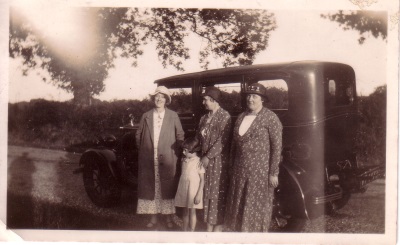 Three ladies by car